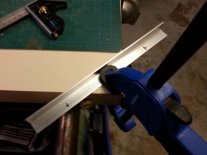 clamp the aluminum to the work surface
