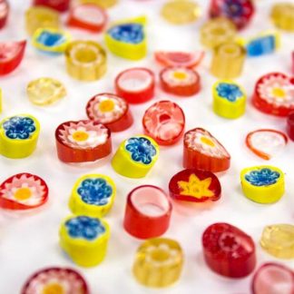 Red-Yellow-Orange Rough Cut Millefiori with shards is cut to irregular thicknesses with some shards and slivers - an affordable product perfectly suited to glass fusing projects.