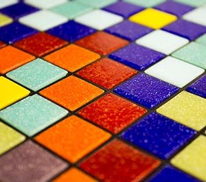 We are excited to tell you about an affordable new line of 3/4" vitreous glass mosaic tile. With a rainbow of intense colors, these tiles will make a beautiful addition to any mosaic art project!